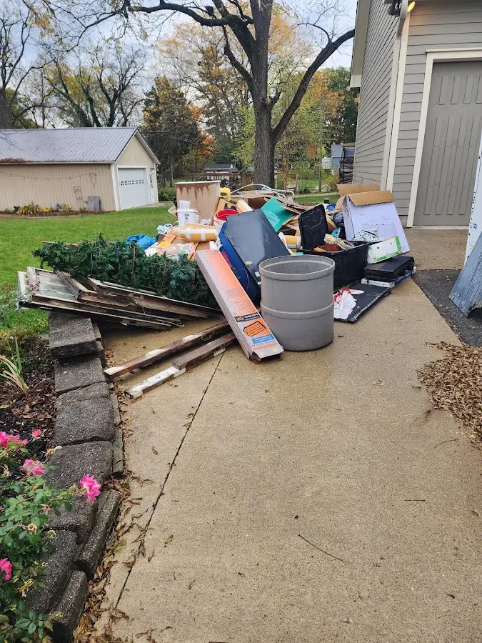Dumpster being loaded with debris for 10 Yard Dumpster Rental in Plattsburgh